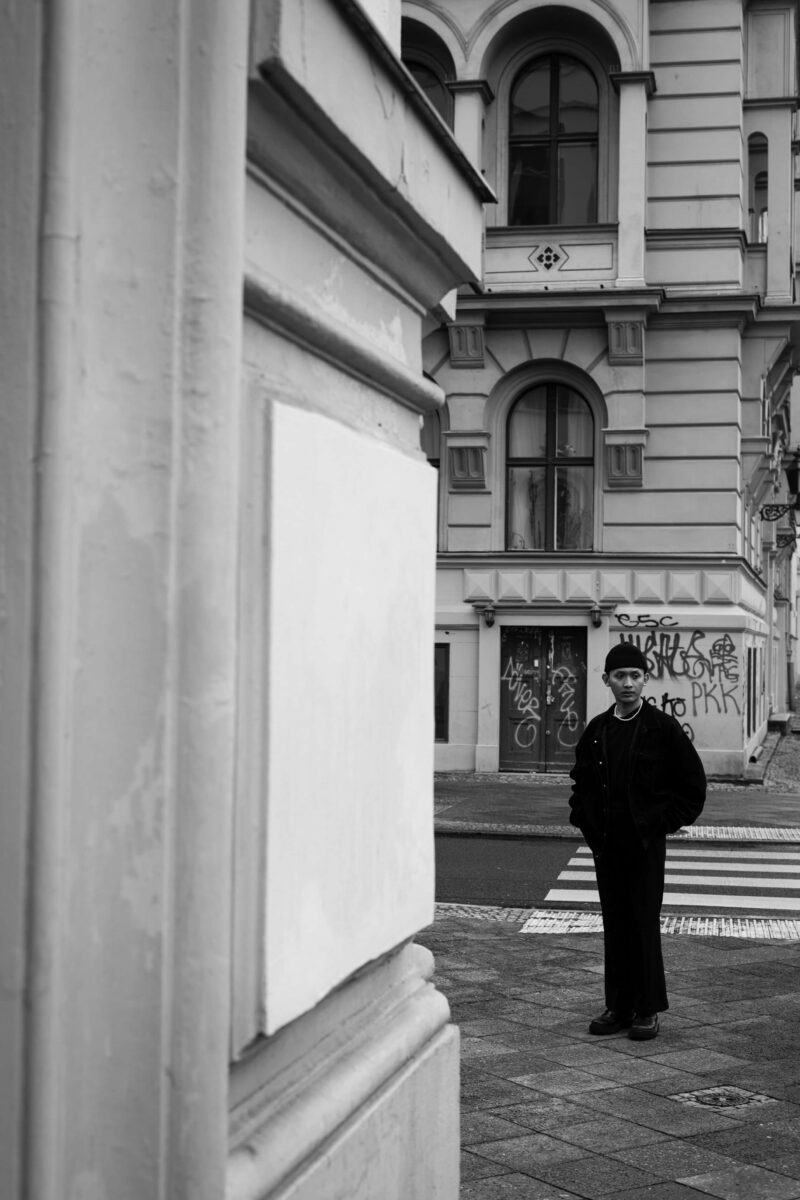 Black and white portrait of a man on a street