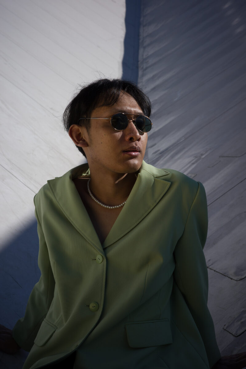 Raw portrait image of a young man made on Ricoh GRIIIx 