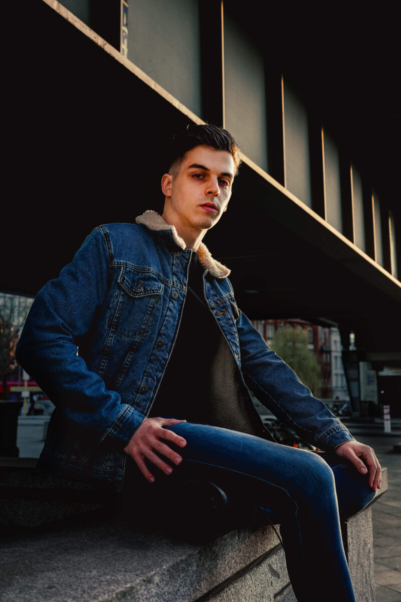 Portrait of a young man on a street