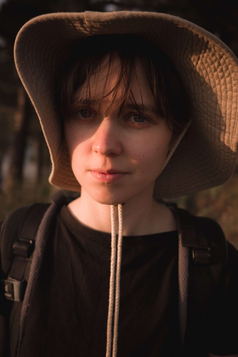 A portrait of a woman outside at sunset
