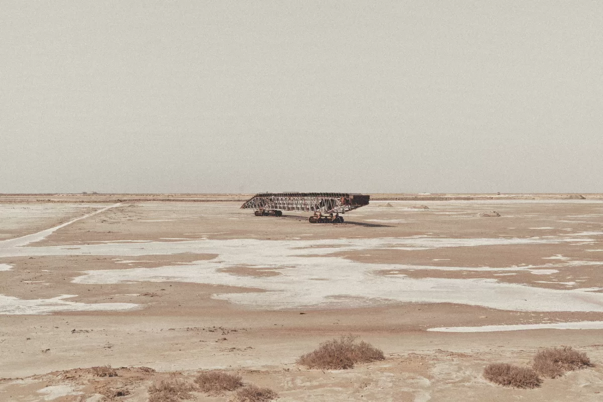 A photograph of a deserted area with rusty machinery.