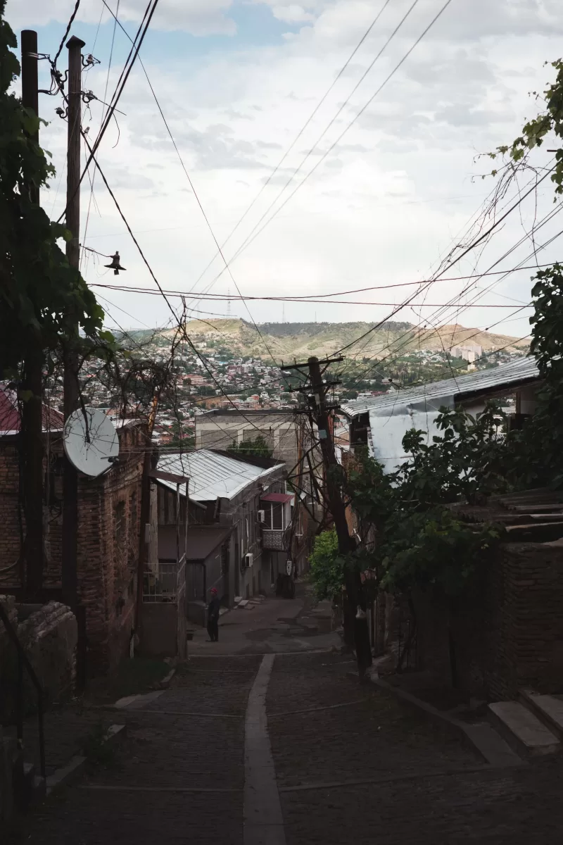 A narrow street in Tbilisi going downhill