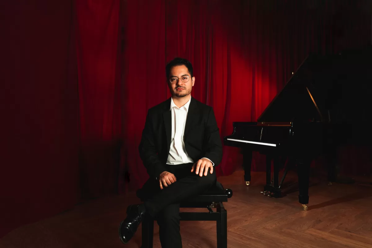 A pianist sitting in a piano room