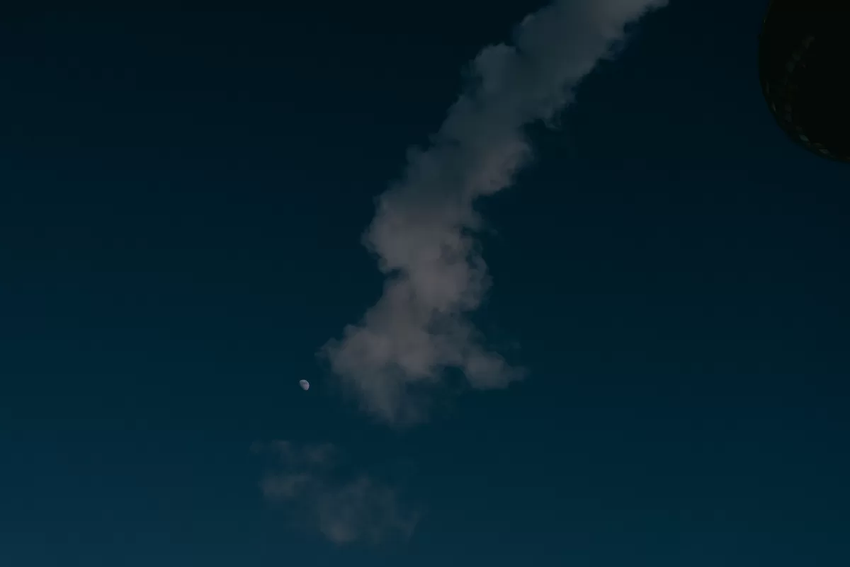 Smoke coming out of Spittelau Incinerator and the moon in the sky. Photograph by Fedor Vasilev