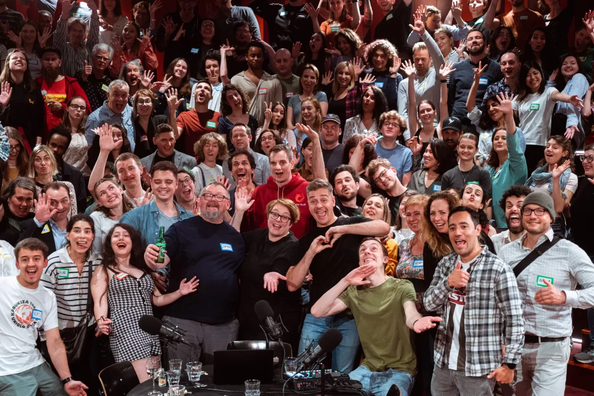 A grand group portrait from a lively and fun, life-podcast event in Vienna