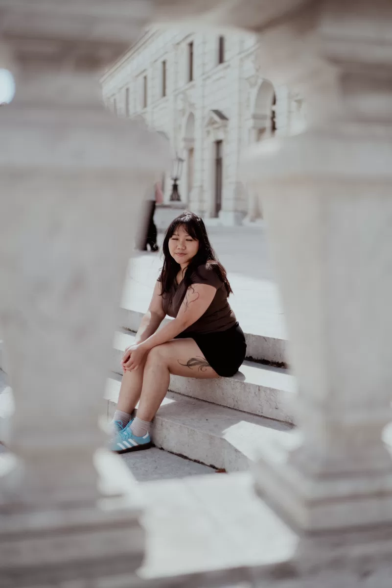 Woman Sitting on the stairs of Hofburg Palace. Vacation photography by Fedor Vasilev
