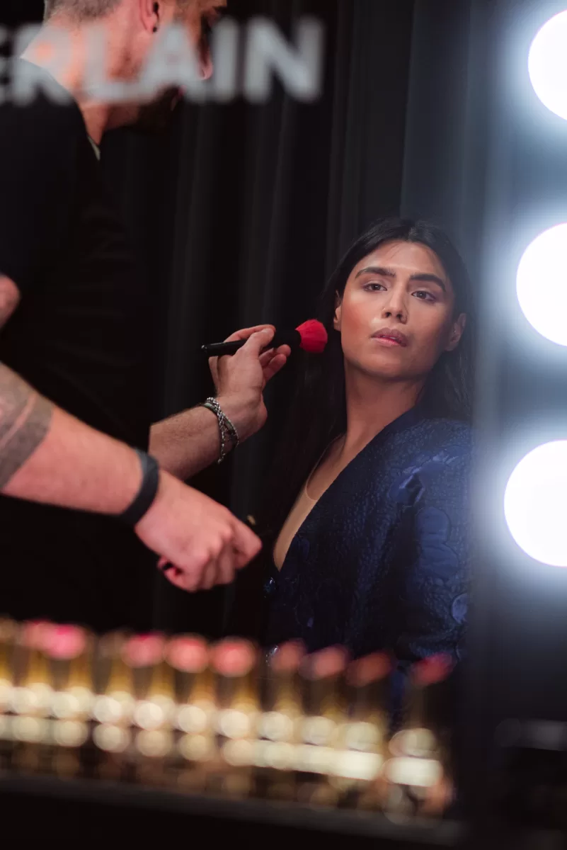 Speaker preparation for an event with makeup application