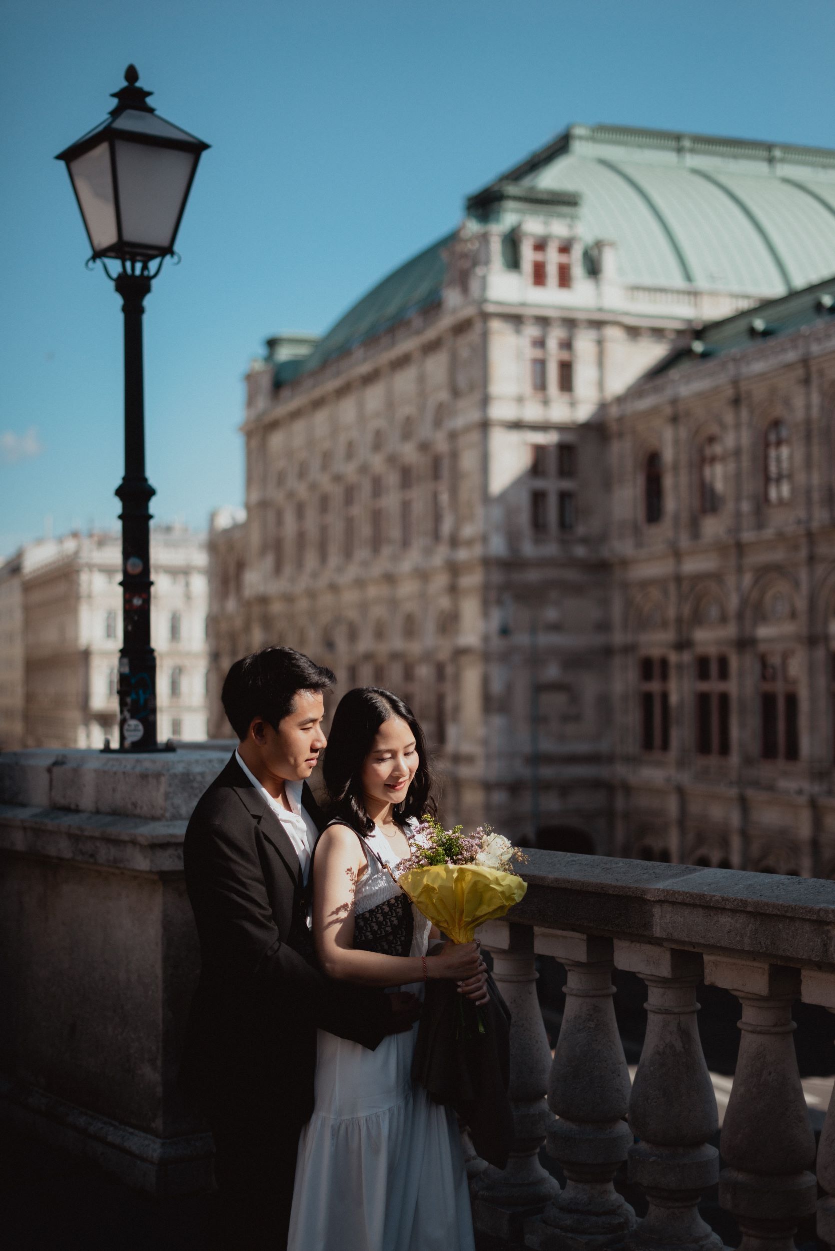 A dramatic photo of a couple hugging on albertina terrace