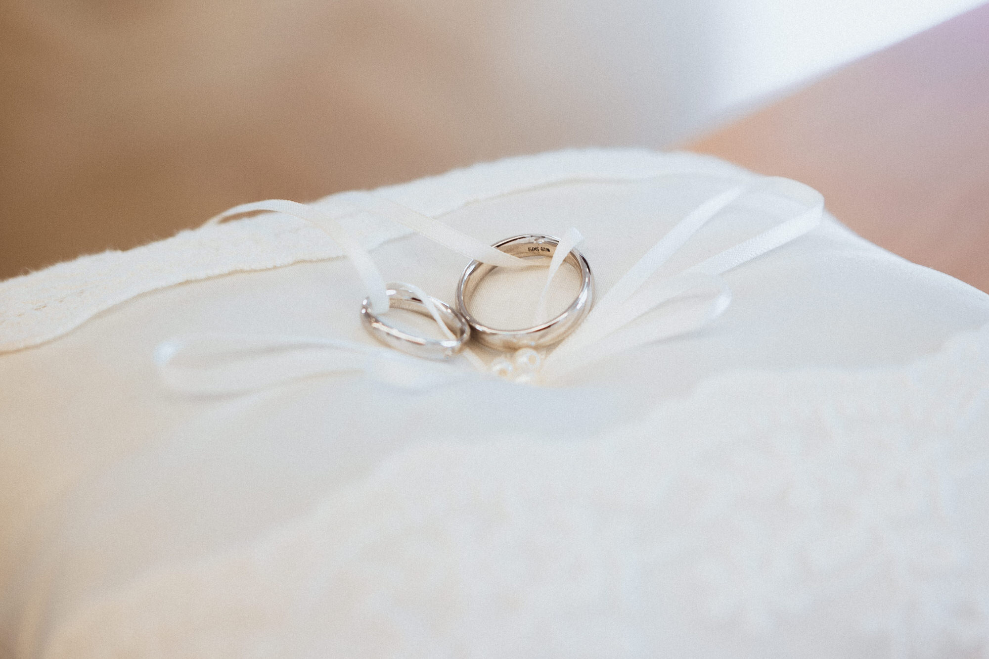 wedding rings on a pillow in a registry office