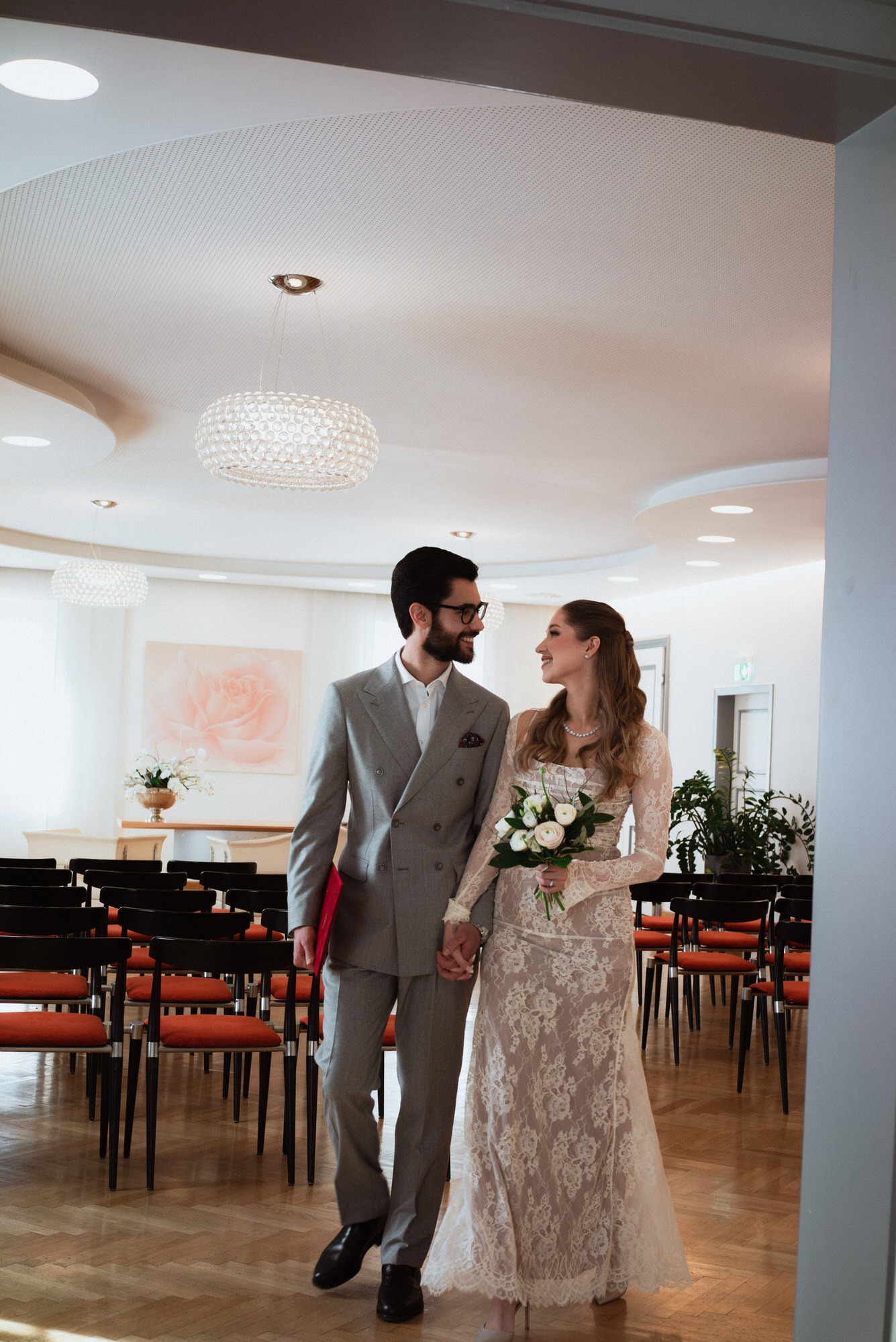 the couple leaving the registry office after their ceremony