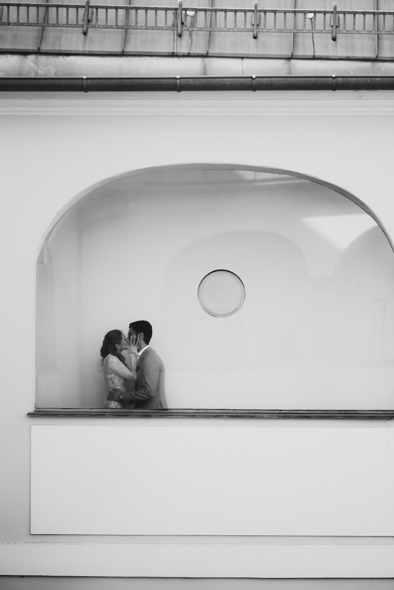 newlyweds kissing in the registry office after their ceremony