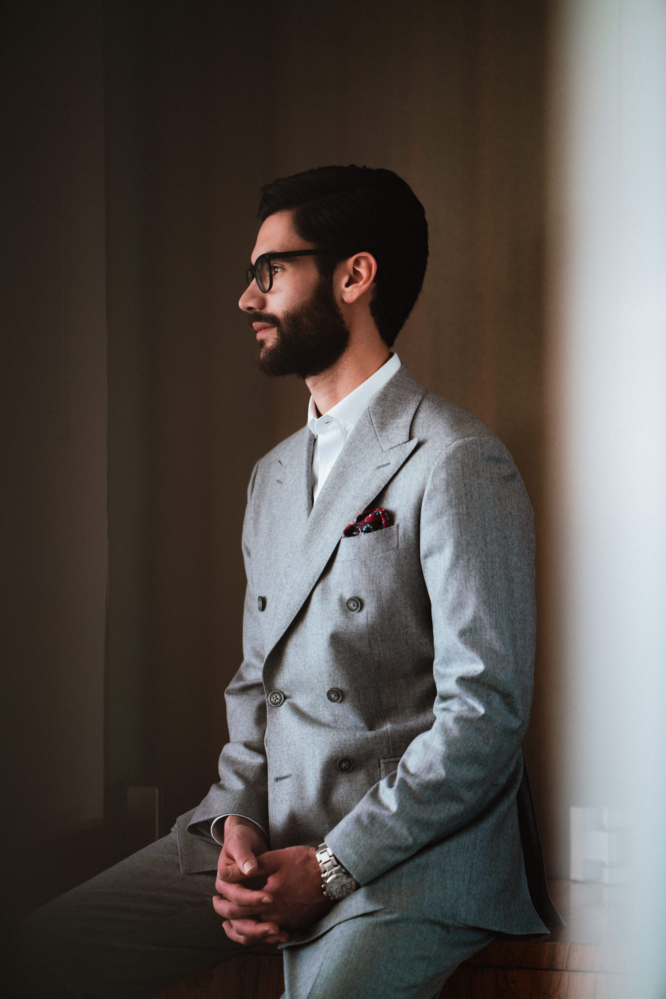a portrait of a groom  waiting in the registry office