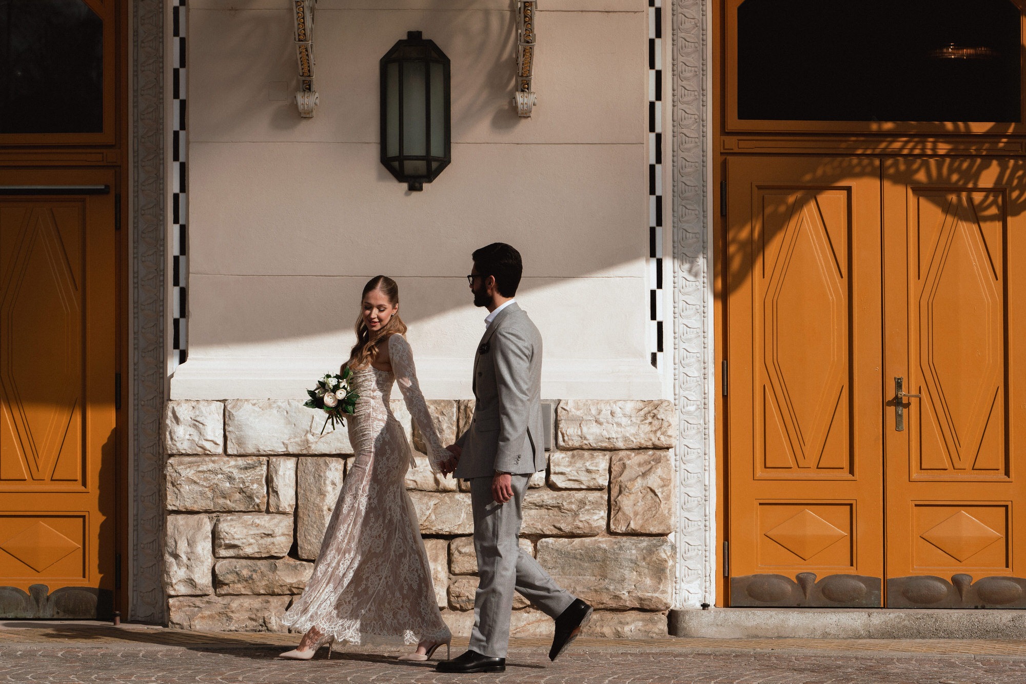 newlyweds walking in front of a registry office in Austria
