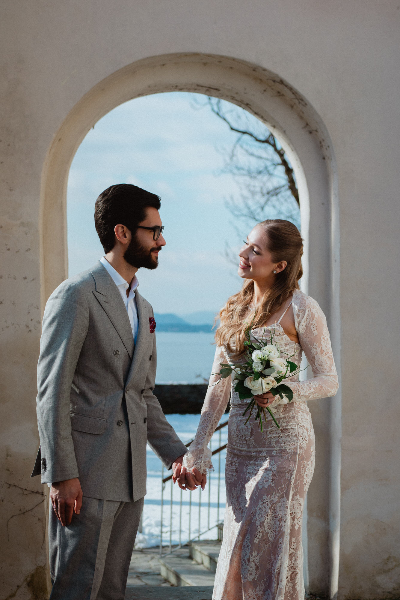 Wedding photoshoot in Austria: the couple holding hands looking at each other in an idyllic location